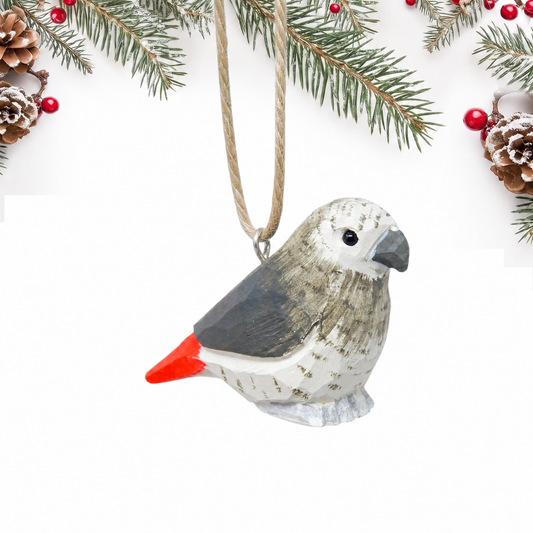 Grey Parrot hand-carved wooden ornament by Selsela, on a plain background