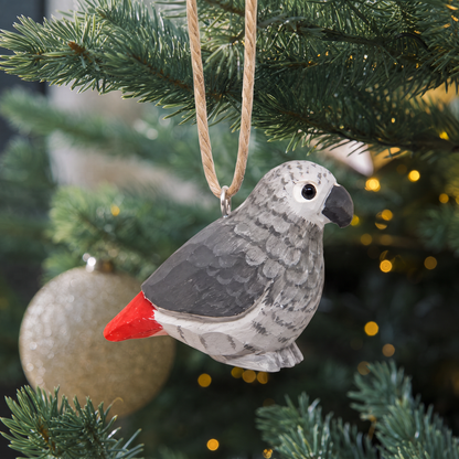 Grey Parrot hand-carved wooden ornament by Selsela, hanging on a Christmas tree