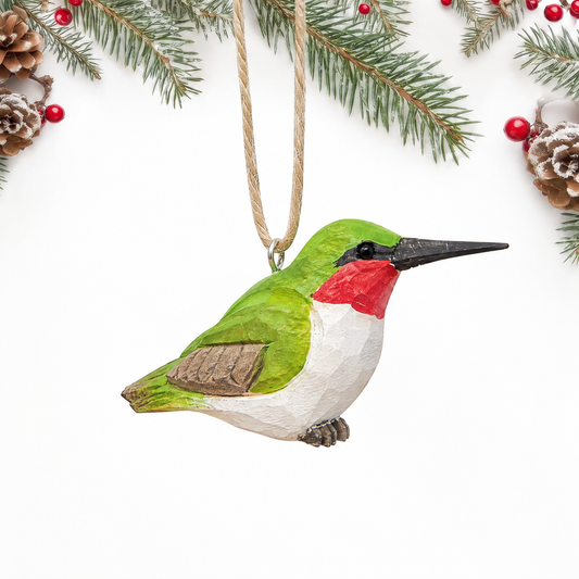 Hummingbird hand-carved wooden ornament by Selsela, on a plain background