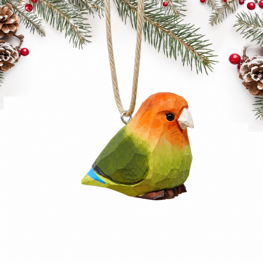 Lovebirds hand-carved wooden ornament by Selsela, on a plain background