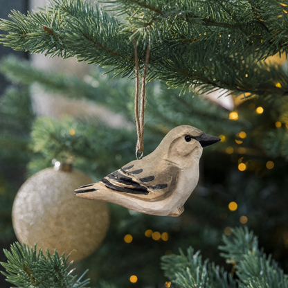 Northern Mockingbird hand-carved wooden ornament by Selsela, hanging on a Christmas tree