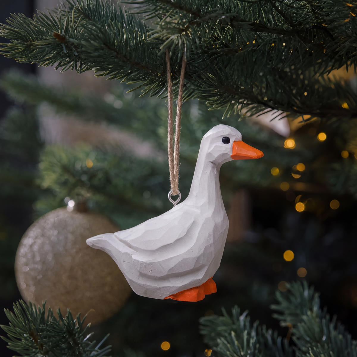White Goose hand-carved wooden ornament by Selsela, hanging on a Christmas tree