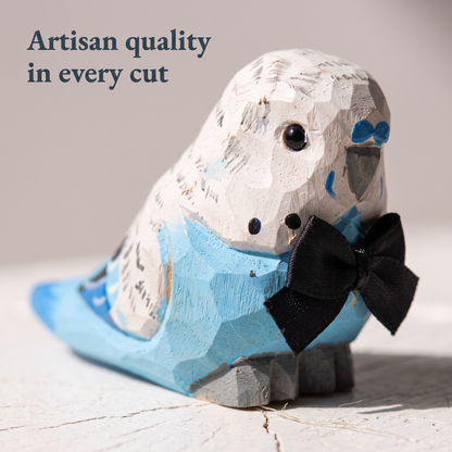 Blue Parakeet hand-carved wooden cake topper by Selsela, bride and groom pair on a wedding cake