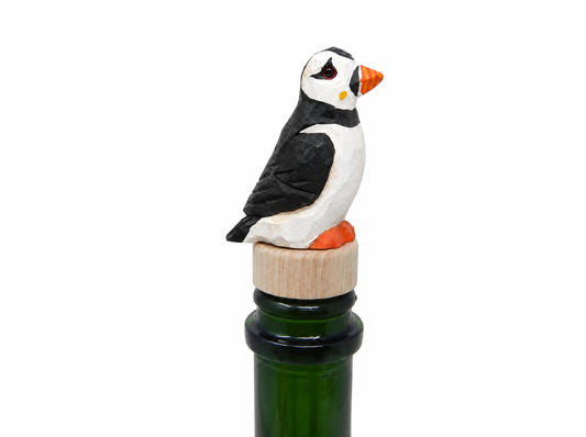 Puffin hand-carved wooden wine stopper by Selsela, on a plain background