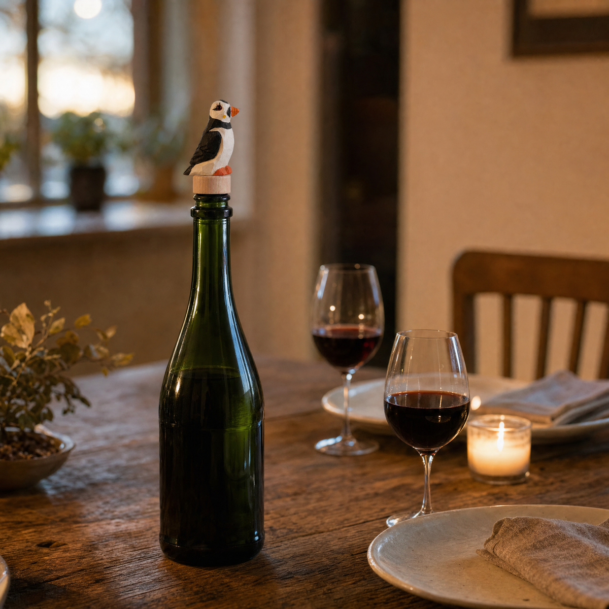 Puffin hand-carved wooden wine stopper by Selsela, in a styled scene