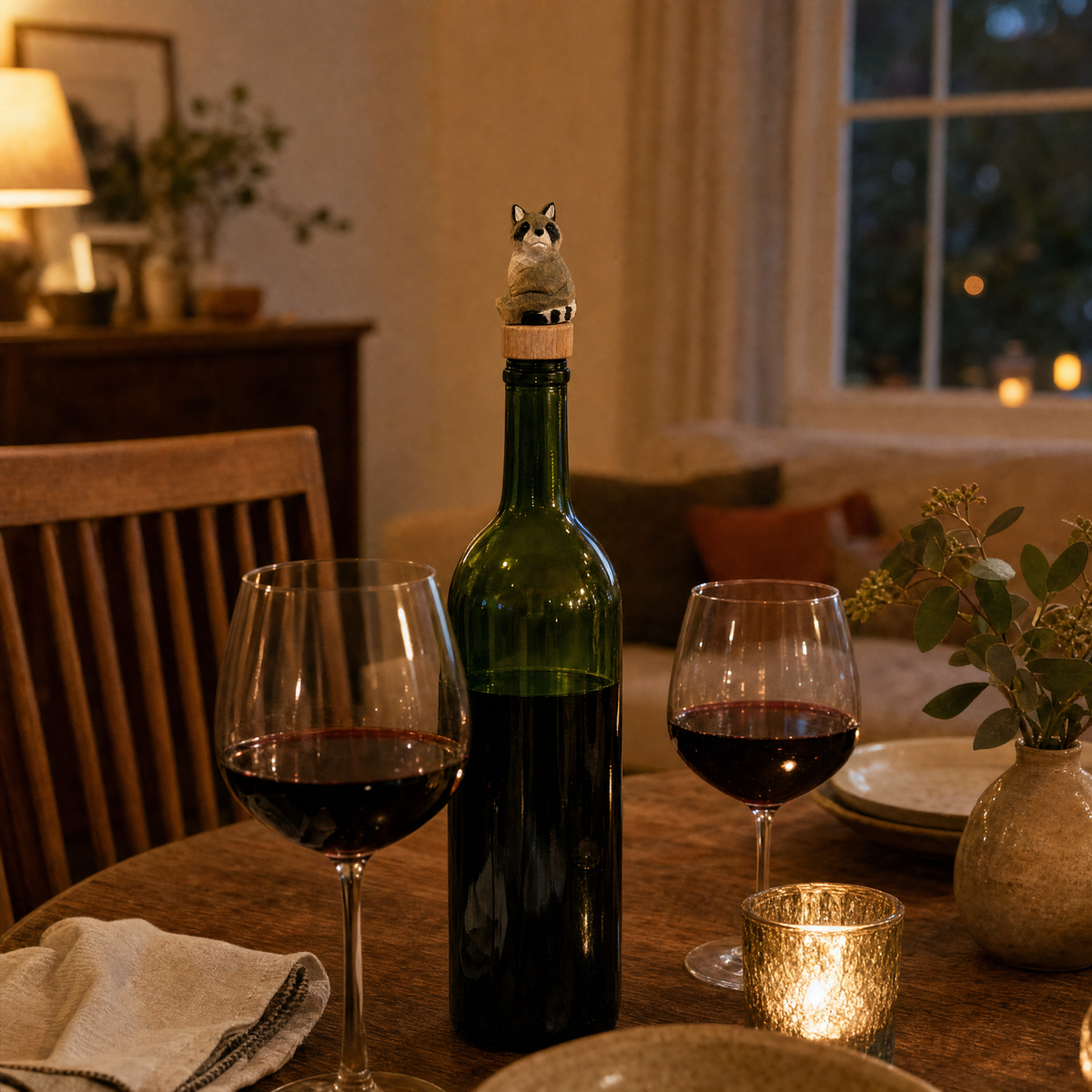 Raccoon hand-carved wooden wine stopper by Selsela, in a styled scene