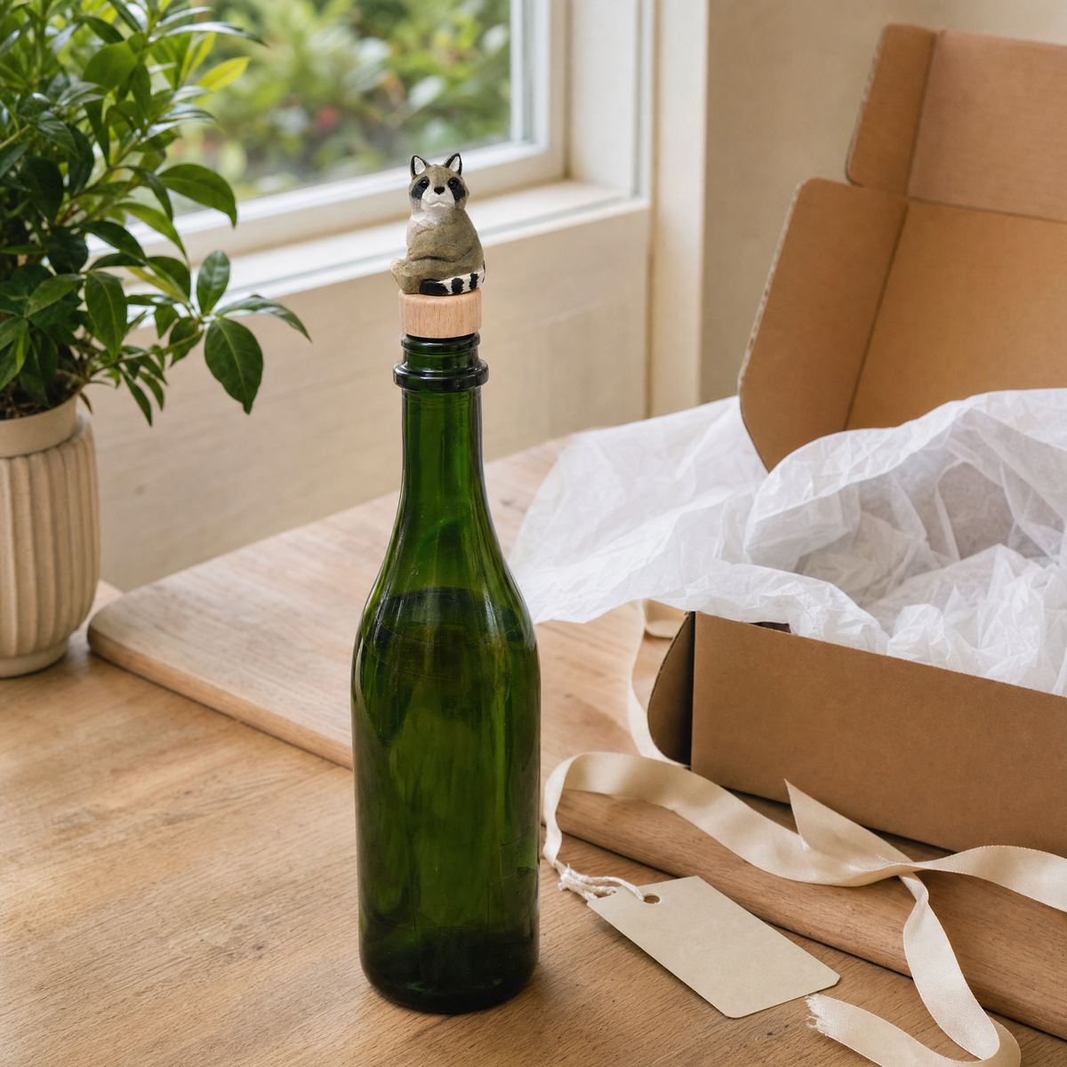Raccoon hand-carved wooden wine stopper by Selsela, in a styled scene