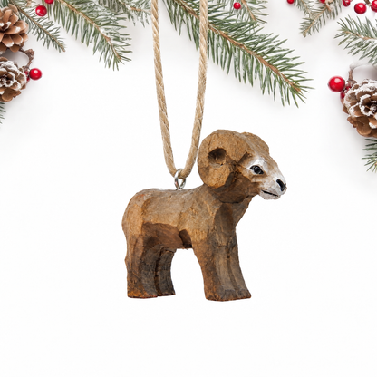 Ram hand-carved wooden ornament by Selsela, on a plain background
