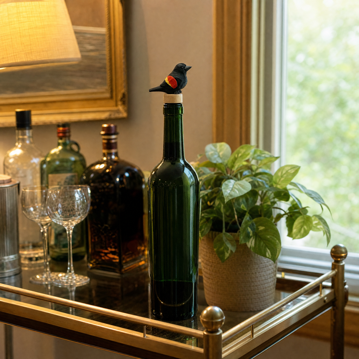 Red-Winged Blackbird hand-carved wooden wine stopper by Selsela, in a styled scene