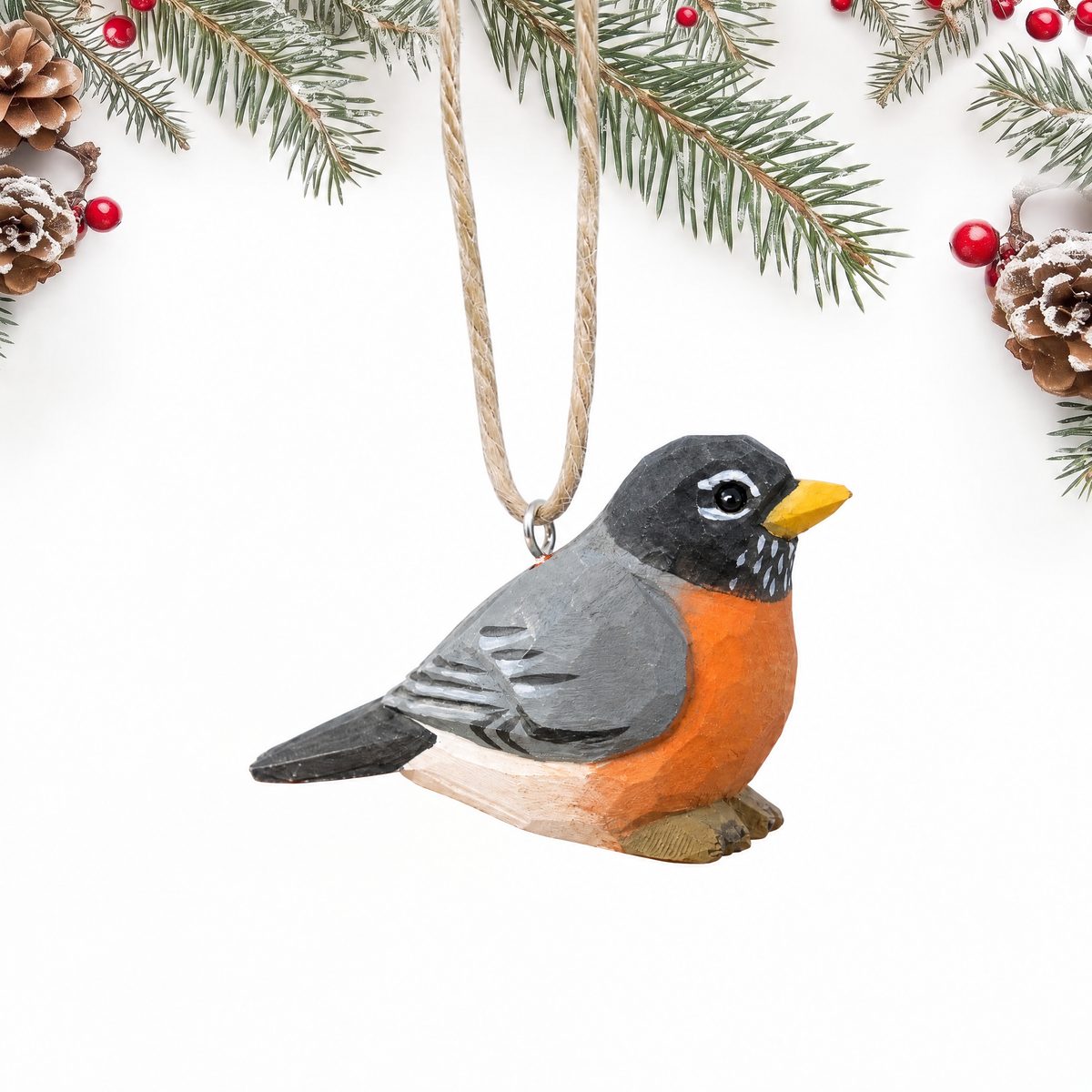 American Robin hand-carved wooden ornament by Selsela, on a plain background